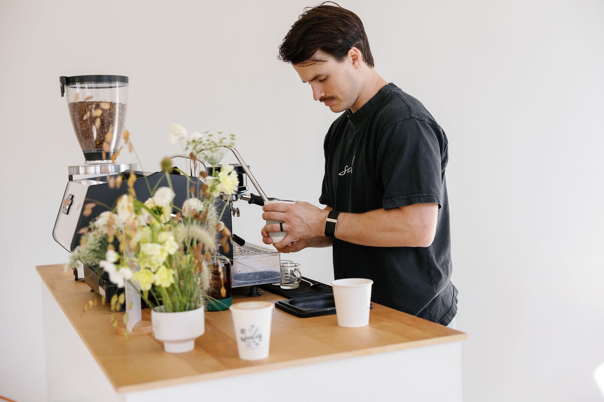 Barista steaming milk