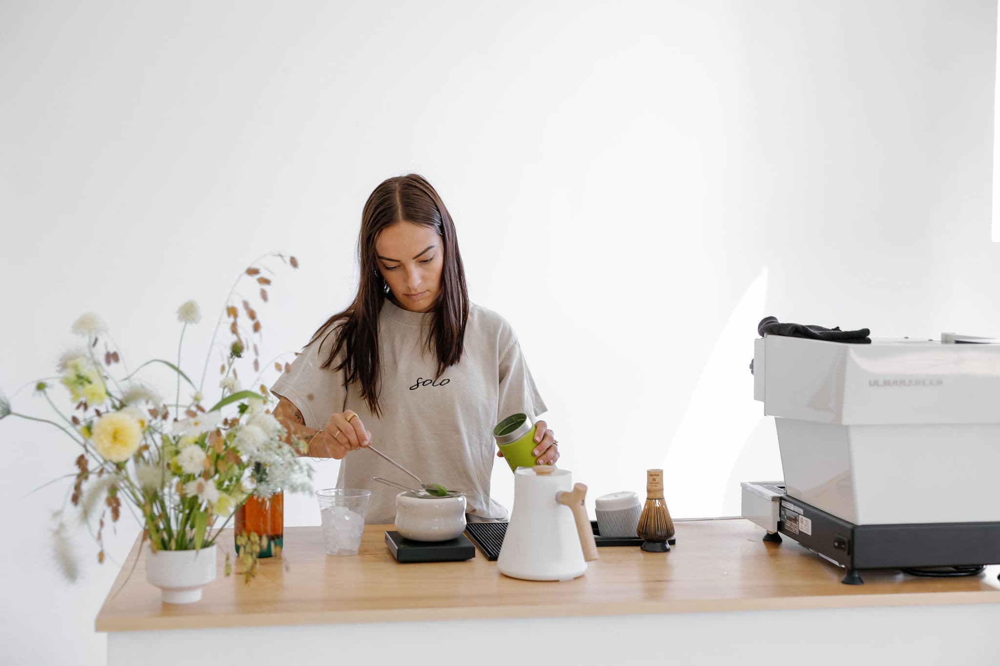 Barista crafting matcha