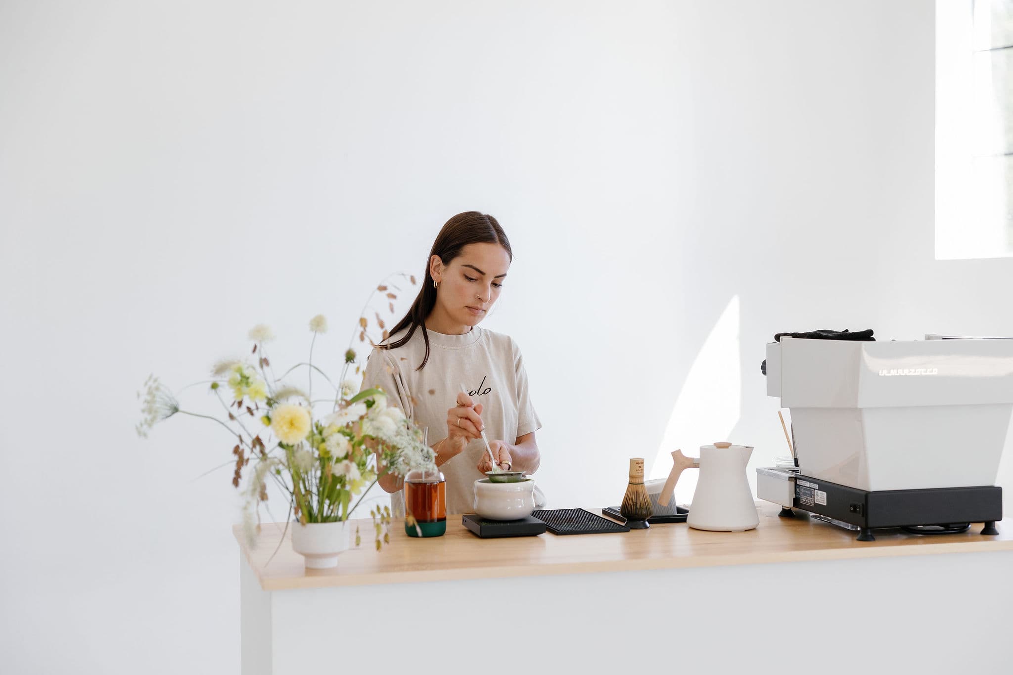 Barista sifting matcha