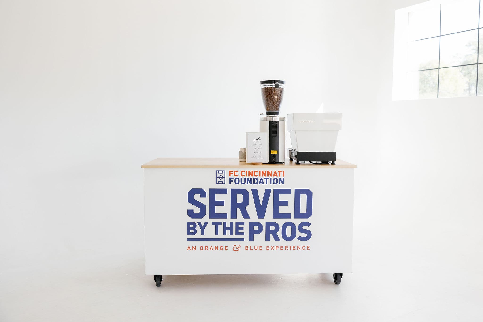 Custom branded coffee cart with event branding