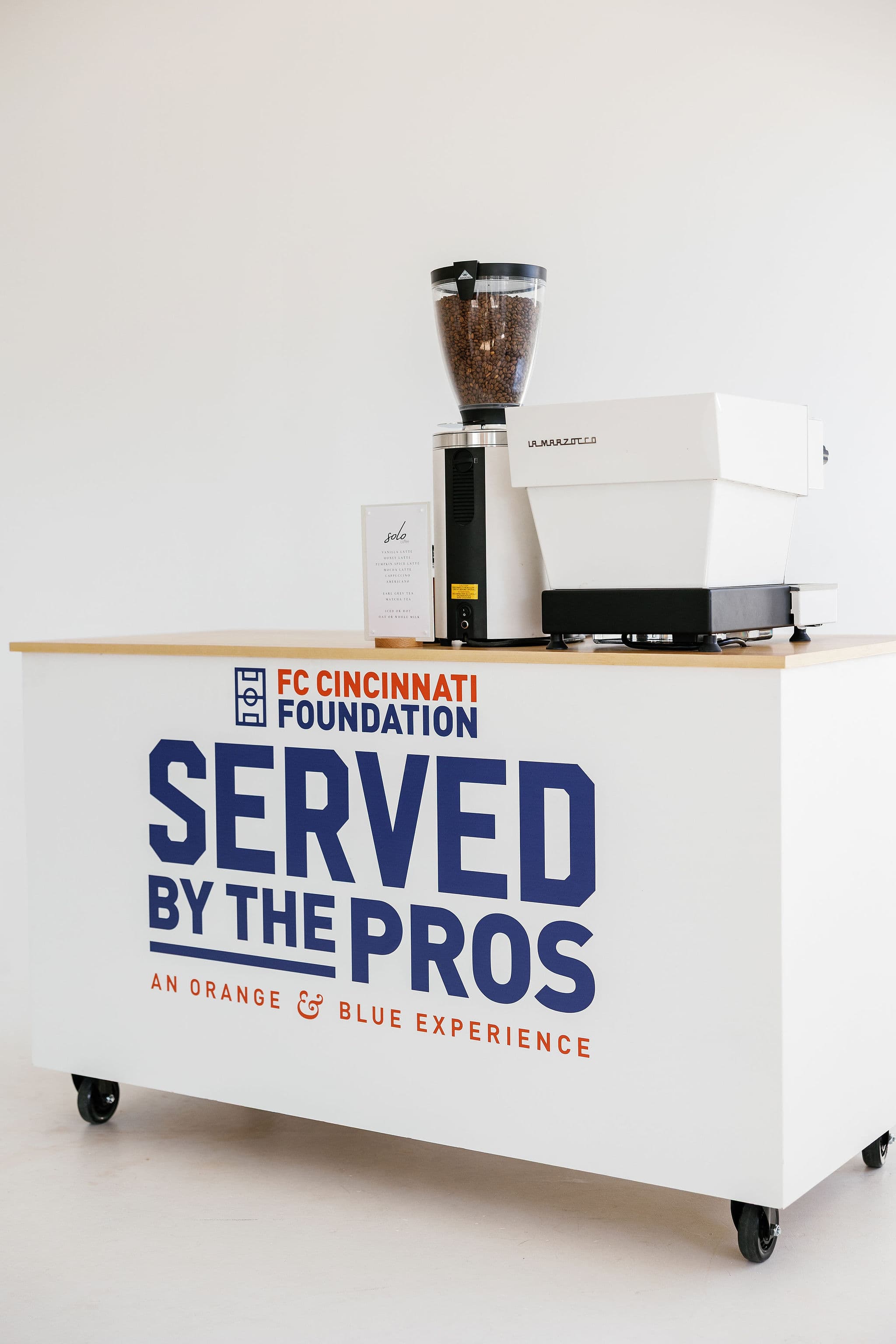 Side view of custom branded coffee cart