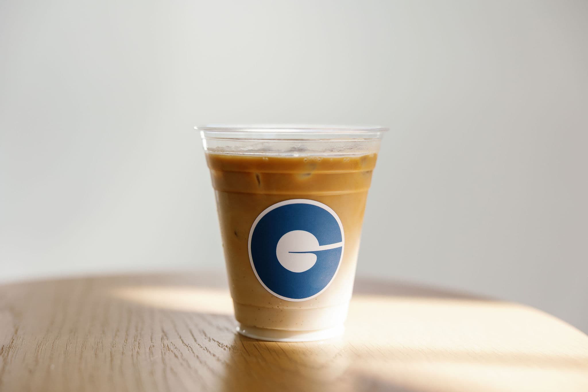 Latte art close up with logo